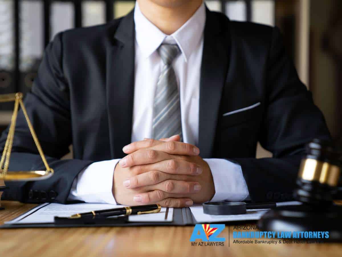 Bankruptcy consultation with attorney reviewing legal documents